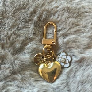 Gold bag charm with heart, flower and circle